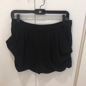 Black shorts with pleated pocket detail